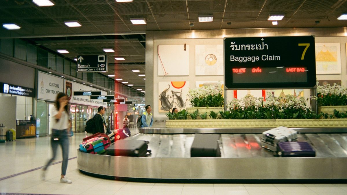 Traveller with cabin luggage at an airport